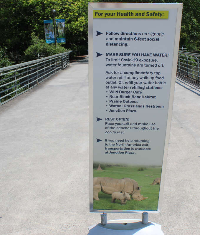 A sign at the North Carolina Zoo in Asheville about guidelines for visiting the zoo during the COVID-19 pandemic.