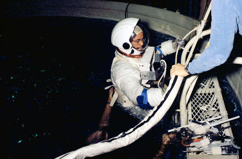 S79-25014 (13 December 1978) --- Astronaut Robert L. Crippen, pilot of the first space shuttle orbital flight test (STS-1), eases into a water immersion facility (WIF) during a training session in the Johnson Space Center's training and test facility
