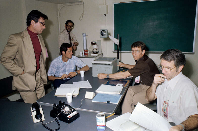 S81-29620 (6 April 1981) --- Prime and backup crew members for STS-1 take part in a briefing with engineers located in another building at NASA's Johnson Space Center (JSC) and with Rockwell International representatives in California via telephone.