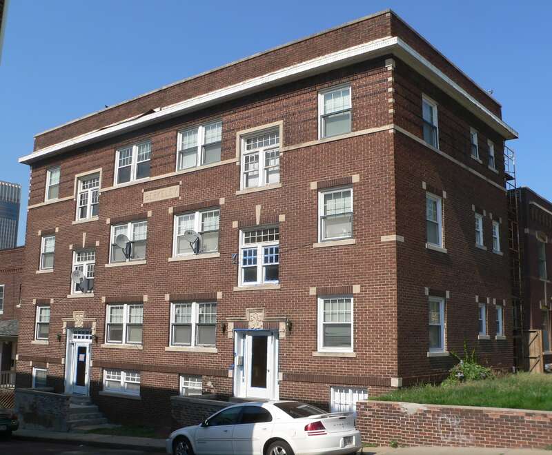 Berkeley Apartments, located at 649 S. 19th Ave. (northeast corner of Jones St. and 19th Ave.) in Omaha, Nebraska; seen from the southwest.  The south side, at right, faces Jones; the sunlit west side, at left, faces 19th Avenue.