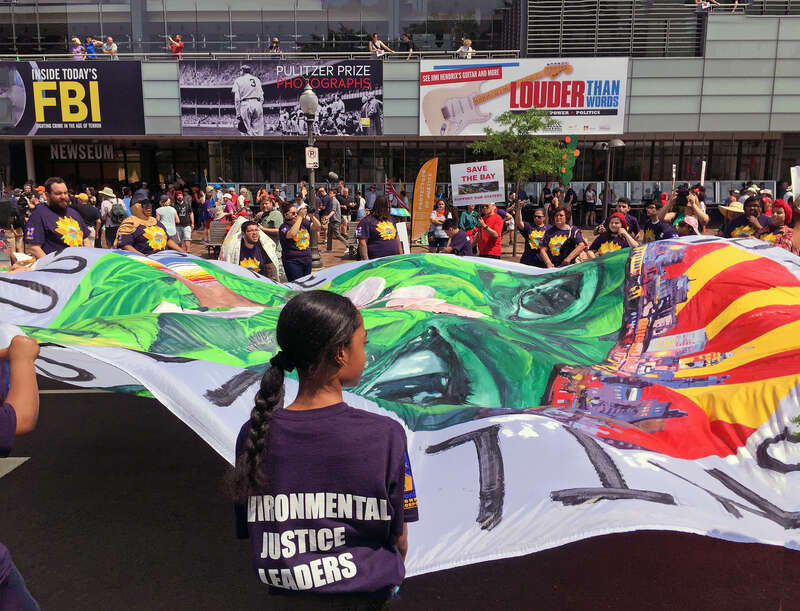 Photos of people, banners, and signs at the People's Climate March on April 29, 2017, in Washington, DC.