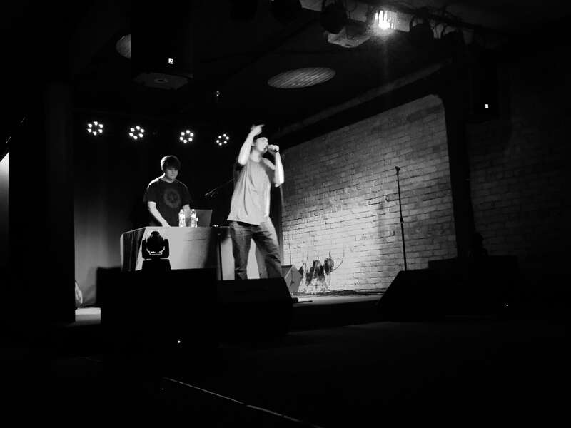 Picture of Duble U (Holding Mic) at his debut concert with fellow rapper Cypher (DJ)