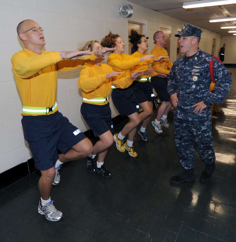 NEWPORT, R.I. (Oct. 23, 2010) Chief Aviation Warfare Systems Operator Steve Smith, a recruit division commander at Officer Candidate School, yells out a cadence to new officer candidates during a physical fitness session at Officer Training Command