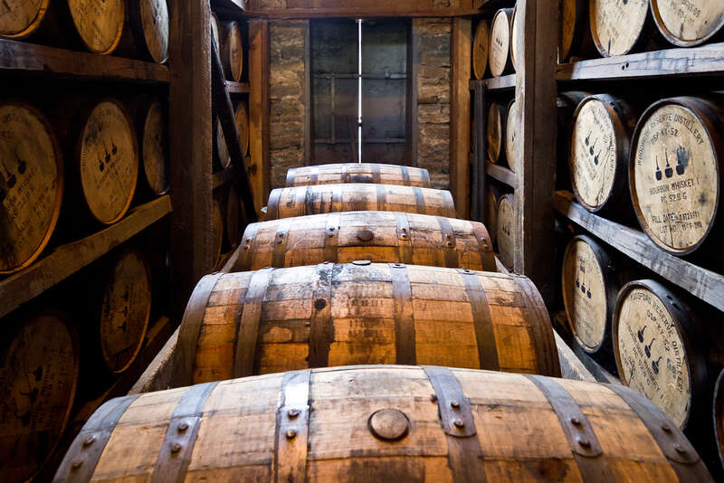 Barrels of Woodford Reserve bourbon age in a rickhouse.Photo taken with an Olympus E-5 at the Woodford Reserve distillery, Versailles, Kentucky, USA.Cropping and post-processing performed with Adobe Lightroom.
