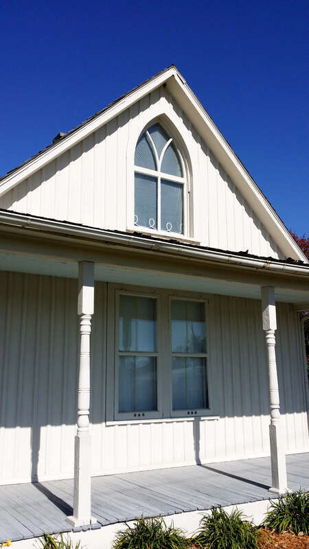 From Wkipedia:
en.wikipedia.org/wiki/American_Gothic_House
The American Gothic House, also known as the Dibble House, is a house in Eldon, Iowa, designed in the Carpenter Gothic style with a distinctive upper window. It was the backdrop of the 1930