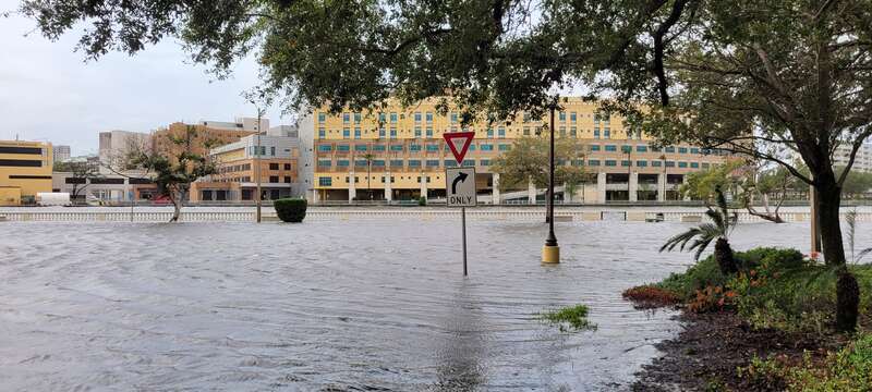 Storm surge from Hurricane Idalia along Bayshore Boulevard in Tampa. Tampa General Hospital is in the background across the Hillsborough River.
