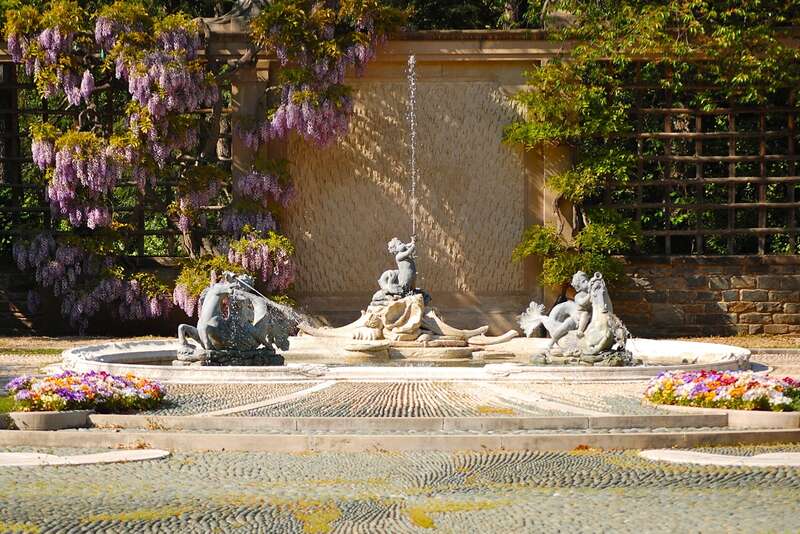 A large fountain in a courtyard at Dumbarton Oaks.