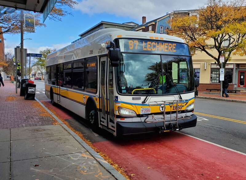 MBTA route 87 bus inbound at Davis station at the newly-installed queue jump in November 2020