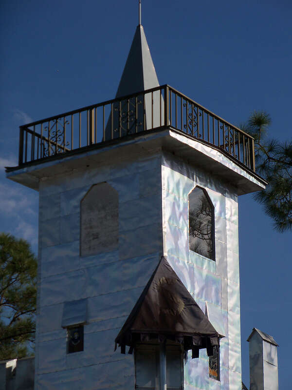 Solomon's Castle in Florida. 
&quot;Castle&quot; built from discarded materials and objects by an eccentric artist in swamps on Ona, Florida; walls are covered with used aluminum printing plates that reflect light.