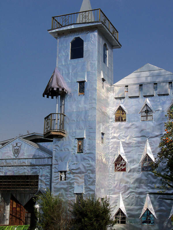 Solomon's Castle in Florida. 
&quot;Castle&quot; built from discarded materials and objects by an eccentric artist in swamps on Ona, Florida; walls are covered with used aluminum printing plates that reflect light.