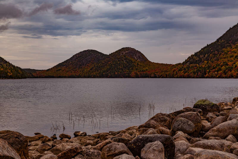The Bubbles (North Bubble and South Bubble mountains) behind Jordan Pond at Acadia National Park in autumn.