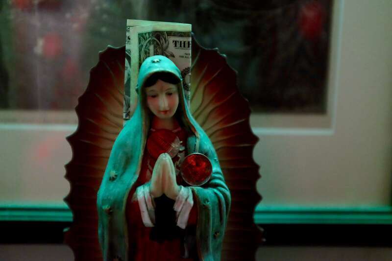 At the Voodoo Museum in New Orleans. Many Catholic saints also represent traditional Voodoo gods or spirits.