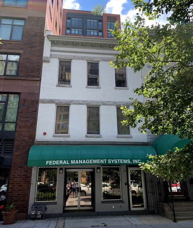 The building located at 460 K Street NW in the Mount Vernon Triangle neighborhood of Washington, D.C. was built for John J. Bowles as a store and to house dairy plant workers. The plant once one stood behind the building in Prather's Alley. Designed