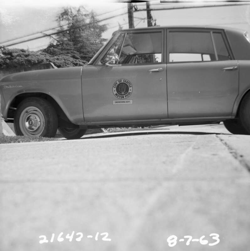 City of Seattle motor pool car, 1963; Seattle, Washington, U.S. Item 181265 gives the address as &quot;NE corner 52nd &amp;amp; Morgan&quot;, which would have to be 52nd Ave S &amp;amp; S Morgan Street in the Seward Park neigborhood; the SE corner there is the