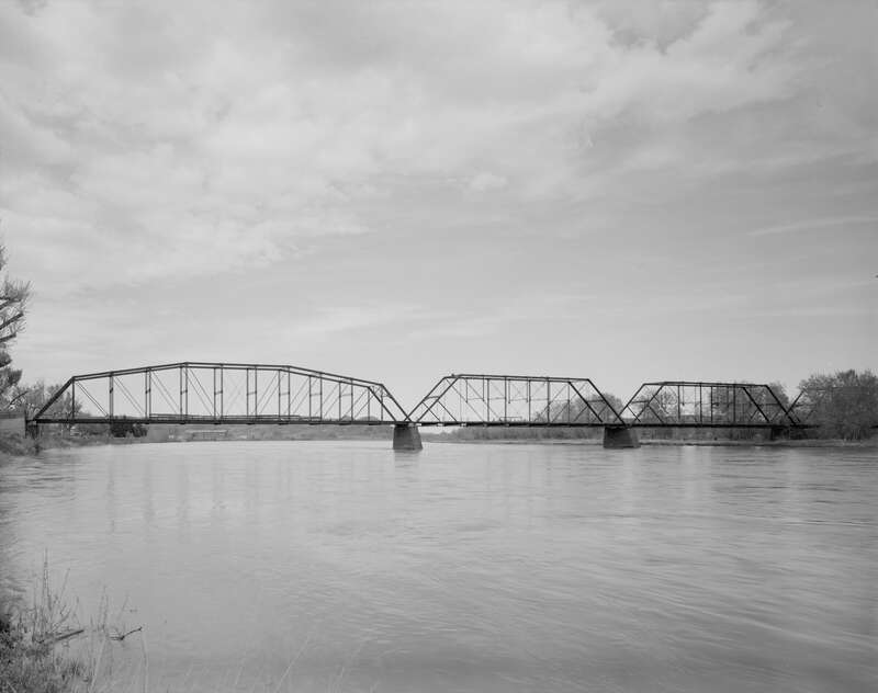 View of the downstream side of the Fort Benton Bridge across the Missouri River at Fort Benton, Montana, United States.  Built in 1888, the bridge is listed on the National Register of Historic Places.