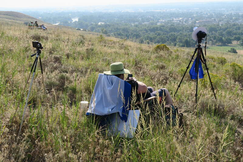 Chair, Camera and iPhone recording timelapse/video.

(we got the chair/backpack for $15 in Walmart and donated it afterwards :-) ).