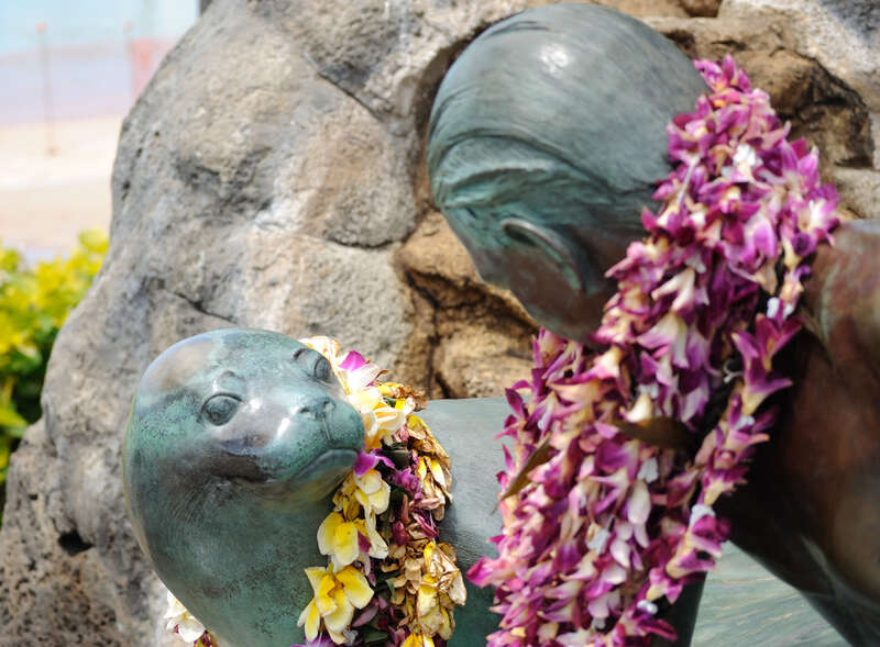 Surfer Boy and Seal Statue - Waikiki