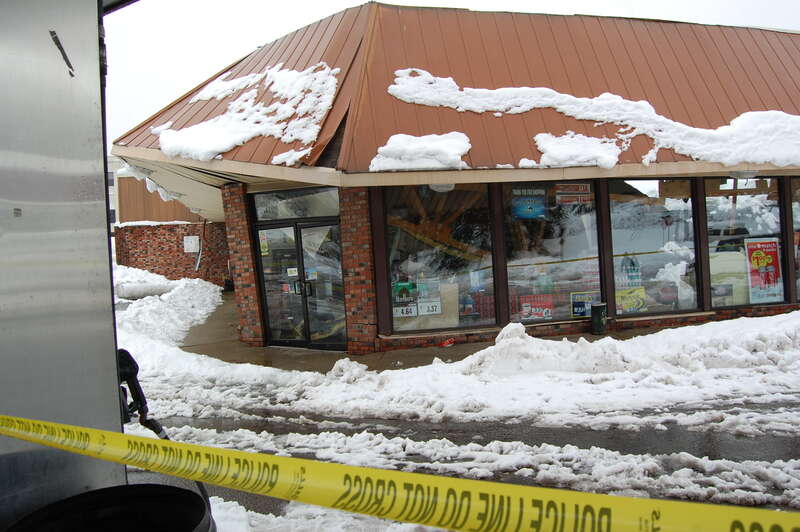 Members of the West Virginia Army National Guard assess a gas station in Summersville, W.Va., for the level of structural damage incurred after Hurricane Sandy brought over two feet of snow to the mountainous region. The soldiers determine whether