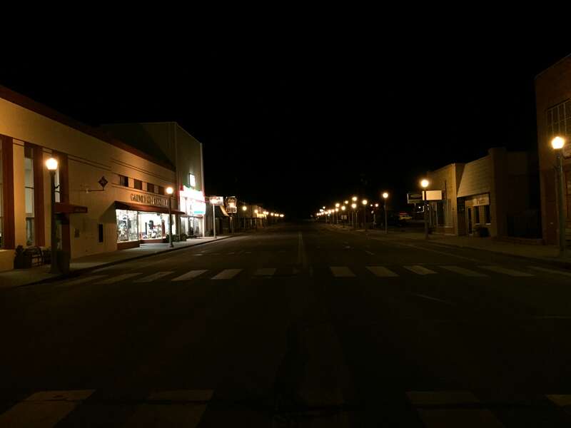 View west along Aultman Street (U.S. Route 50) at 4th Street in Ely, Nevada at night