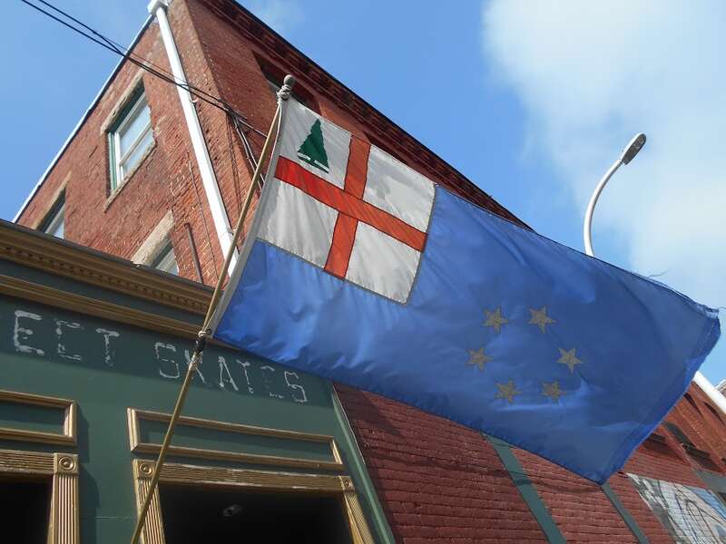 &quot;The Flag of New England as designed by Albert Ebinger of Ipswich MA adopted by the New England Governor's Conference on 8 June 1988&quot;
https://en.wikipedia.org/wiki/Flag_of_New_England