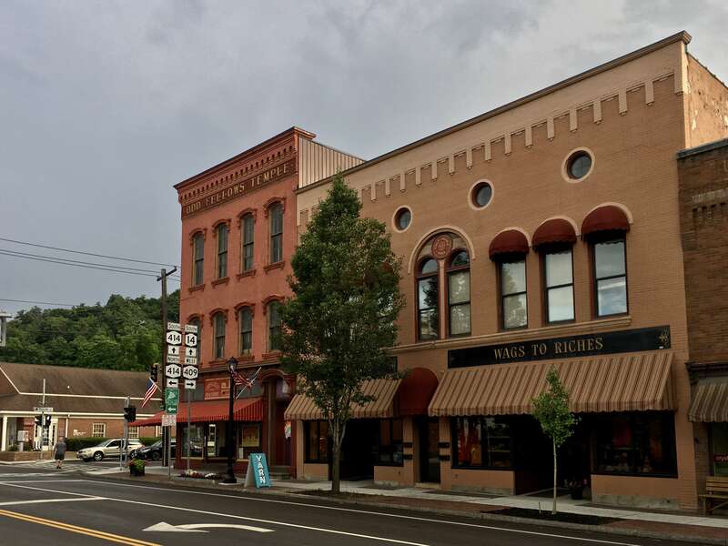 The former Odd Fellows Temple (built c. 1870, left) and Cole-Royce Hall (1925, right) on Franklin Street in downtown Watkins Glen, New York, looking south toward the corner of 4th Street, June 2020.