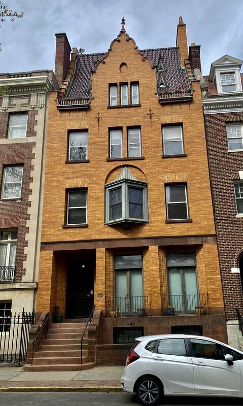 The Morris L. Ryder House, 317 State Street, Albany, New York, May 2022. Dating to 1899, this three-and-a-half-story rowhouse exemplifies the Dutch Colonial Revival style with its Classical ornamentation, the unusual curved pitch of its side-gabled
