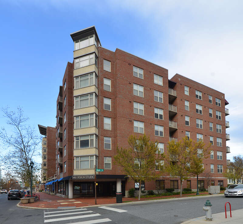 A mixed-use apartment building with retail on the ground floor. Smile Desgin Studio has the corner location.  8201 Wisconsin Avenue, Bethesda, Maryland 20814.