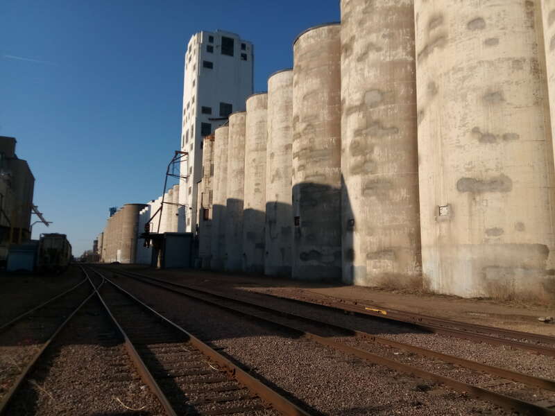 Train tracks and concrete silos near Hiawatha Avenue.