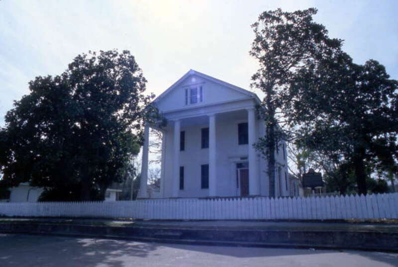 Local call number: COM05719
Title: David G. Raney House located at 128 Market St. in the Apalachicola Historic District
Date: ca. 1985
General note: A nearby historical marker reads: &quot;During the 1830's, when the cotton port of Apalachicola was