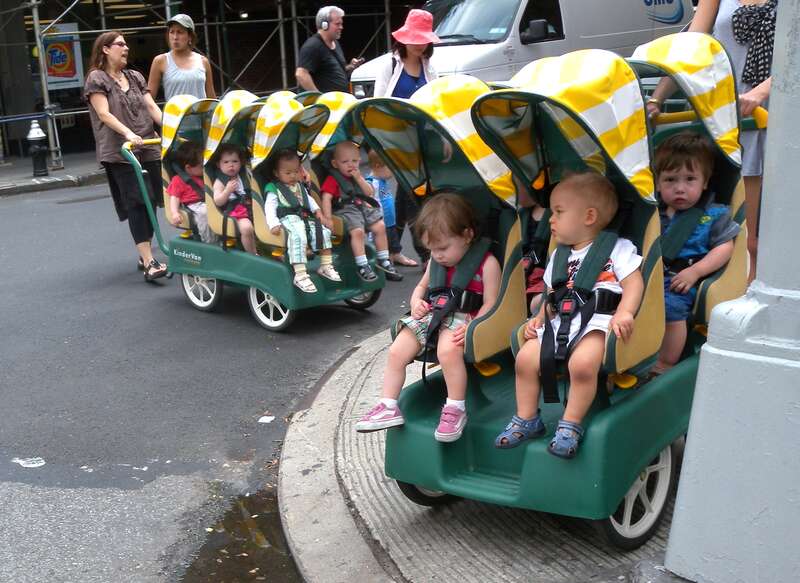 Looking northeast at mass transit crossing 55th Street and 9th Avenue.