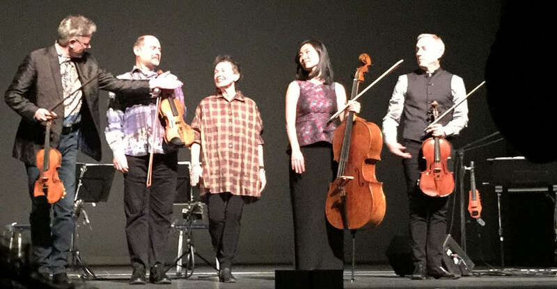 Laurie Anderson amidst the Kronos Quartet in Chicago after performing LANDFALL w:oratorio at the Harris Theater for the Arts located underneath the downtown/off-lakefront w:Millennium Park. Original description on Flickr: At the Harris Theater for