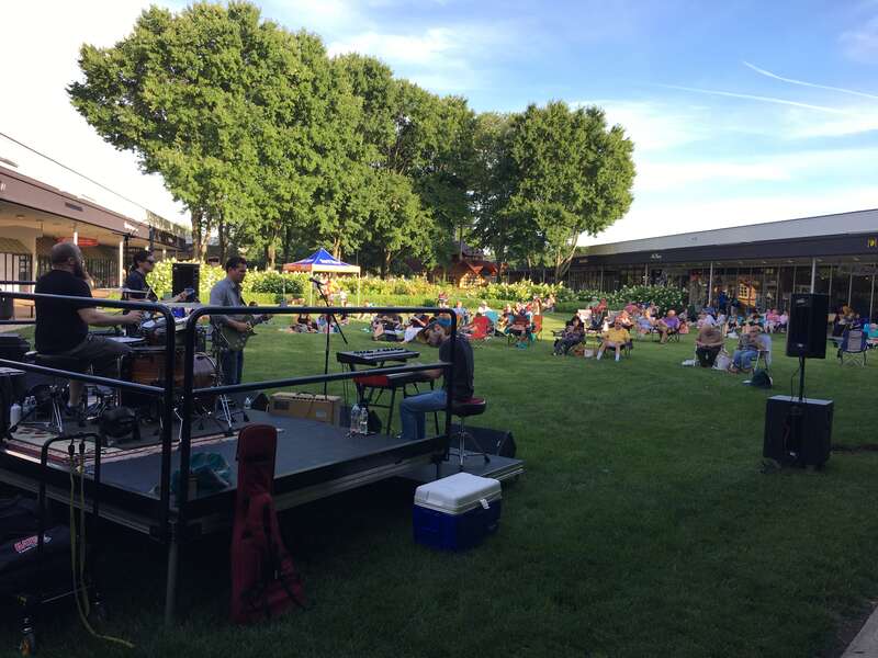 Northernmost portion of the central courtyard of the Princeton Shopping Center on North Harrison Street in Princeton, New Jersey, from the perspective looking south. A weekly Thursday evening concert is taking place, in this case featuring The Dirk