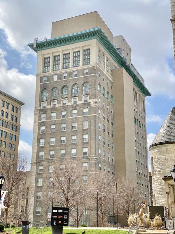 Built in 1918, this Classical Revival-style building was designed by Eames and Young to house the University Club of St. Louis and leasable office space.  The building features a brown brick exterior with limestone trim and a limestone base,