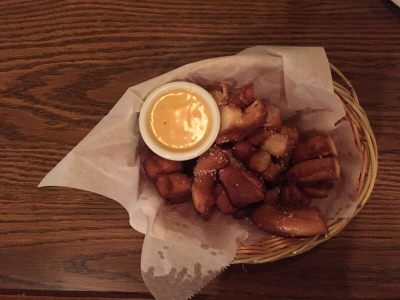 Starter with pieces of pretzel and a mustard honey dip in Schmidt's Sausage Haus in Columbus, Ohio
