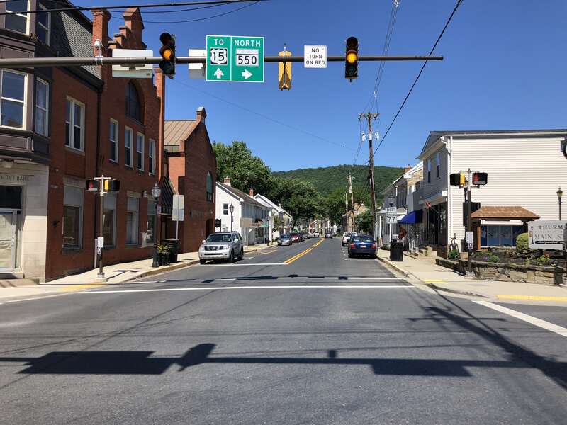 View west along Maryland State Route 77 and north along Maryland State Route 550 (Main Street) at Church Street and Water Street in Thurmont, Frederick County, Maryland