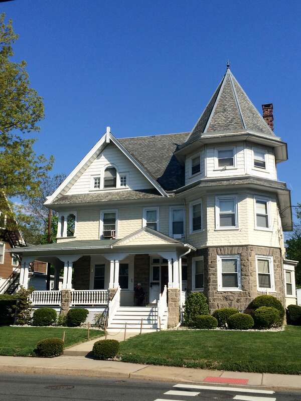 A fine example of &quot;carpenters&quot; Queen Anne architecture with lapped shingles and a hexagonal tower. It is typical of the spacious Victorian houses in the neighborhood.  Built in 1880.