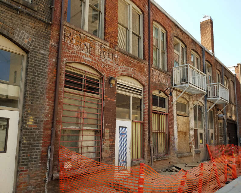 A ghost sign that may read, Boise Rubber Stamp &amp;amp; Etc. is visible in Union Block Alley, Boise, Idaho.