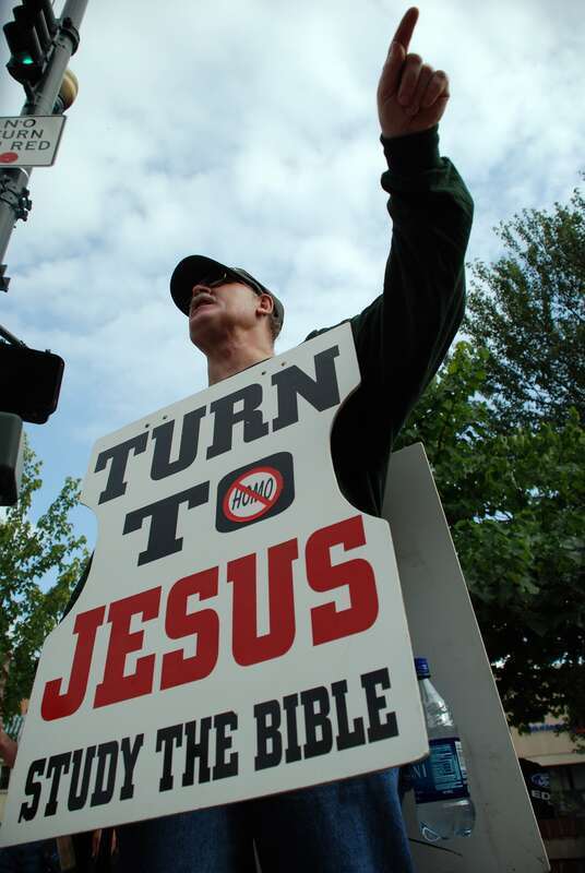 In the thick of the Bele Chere street festival, some demonstrators used the occasion to get their message out. It reads: &quot;Turn to Jesus, read the bible&quot;