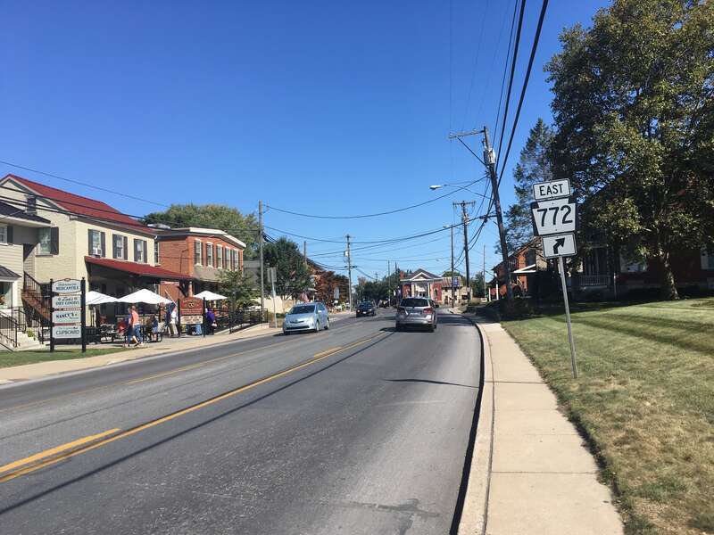 Eastbound Pennsylvania Route 340/Pennsylvania Route 772 (Main Street) approaching their split in Intercourse, Pennsylvania, where Pennsylvania Route 340 continues east on Old Philadelphia Pike and Pennsylvania Route 772 turns southeast onto Newport