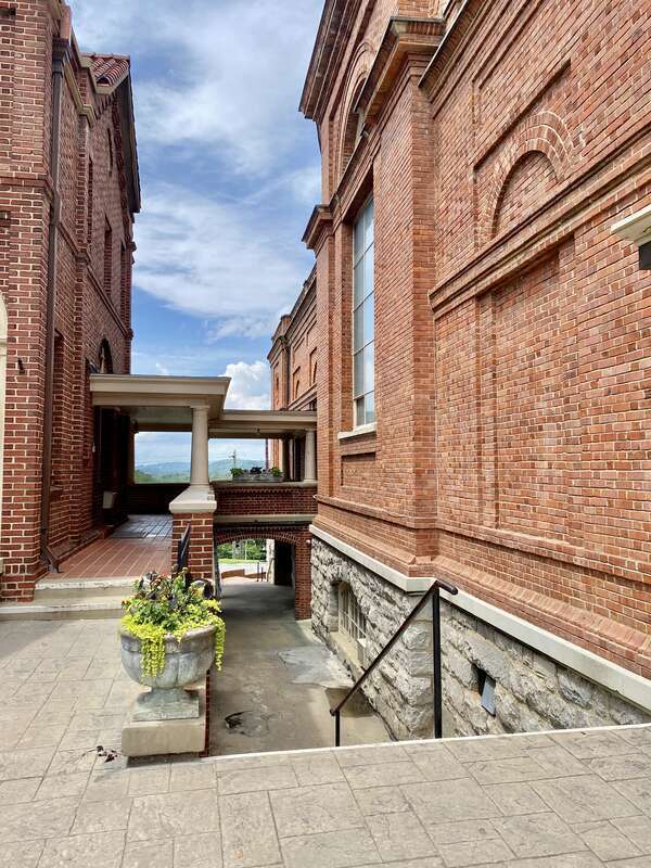 Built in 1905, this Spanish Baroque Revival-style church was designed by Rafael Gustavino and Richard Sharp Smith to serve as the St. Lawrence Roman Catholic Church, serving catholics in the city of Asheville.  The building features a red flemish