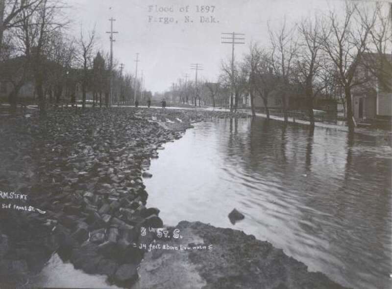 A flooded street in downtown Fargo, ND; April 1897.  The picture was taken on 8th Street S.
