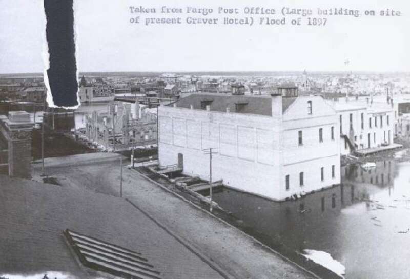 Flood damage in Fargo, ND from the April 1897 flood of the Red River.  This image was taken from the Fargo Post Office.