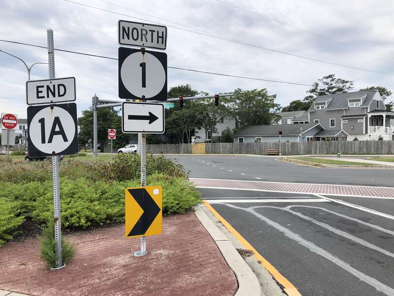 View south along Delaware State Route 1A (King Charles Avenue) at Delaware State Route 1 (Coastal Highway) in Dewey Beach, Sussex County, Delaware