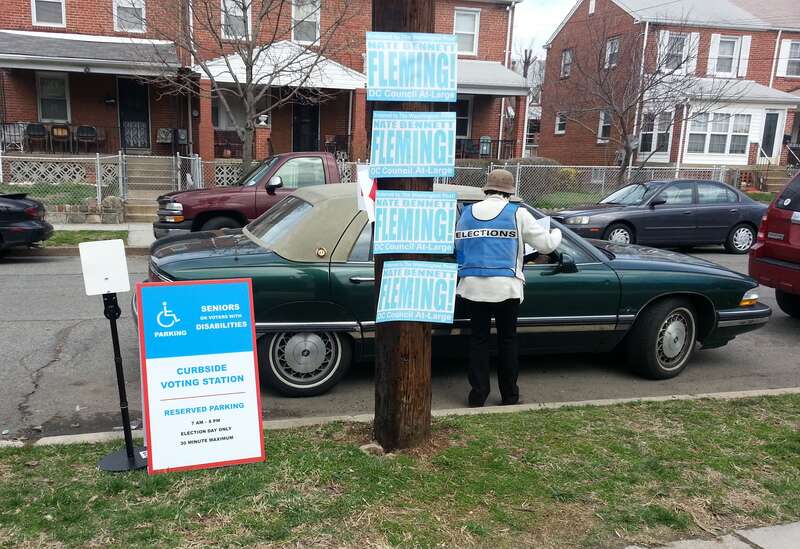 Curbside voting at the U Place SE entrance to the Anacostia Branch of the D.C. Public Library on primary election day, April 1, 2014.  
Many disabled want to vote, but find it difficult to locate a caretaker to get them in and out of their car.  D.C.