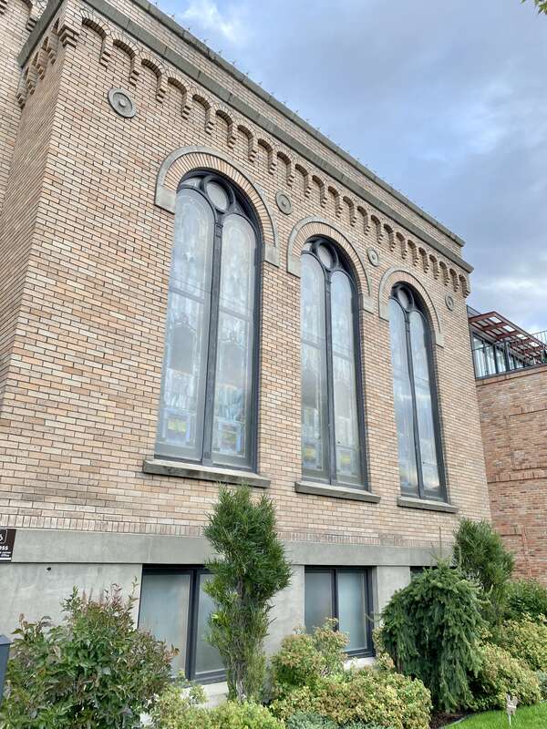 Built in 1921, this stripped and stark Romanesque Revival-style church, home to a Presbyterian congregation, stands at the corner of Central Avenue and 3rd Street in downtown Whitefish, Montana.