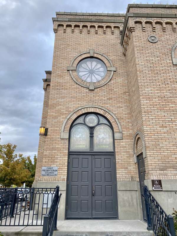 Built in 1921, this stripped and stark Romanesque Revival-style church, home to a Presbyterian congregation, stands at the corner of Central Avenue and 3rd Street in downtown Whitefish, Montana.