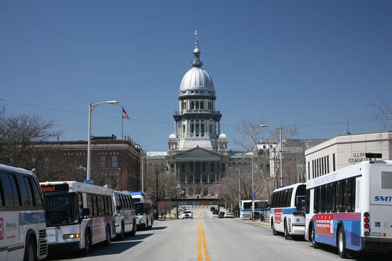 Illinois State Capitol and Springfield public transport busses.