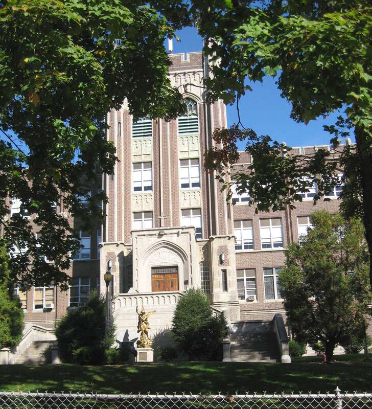 Looking northeast at central tower of en:Mount Saint Michael Academy on a sunny midday.