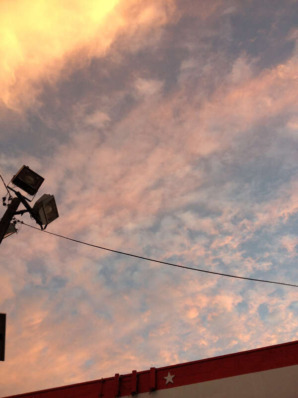 Cloud formations reflecting the sunset after a partly raining partly sunny day, taken while facing east in the parking lot of the American Self-Storage facility at 190 Baldwin Avenue in Jersey City, New Jersey.

This photo was created by Luigi Novi.