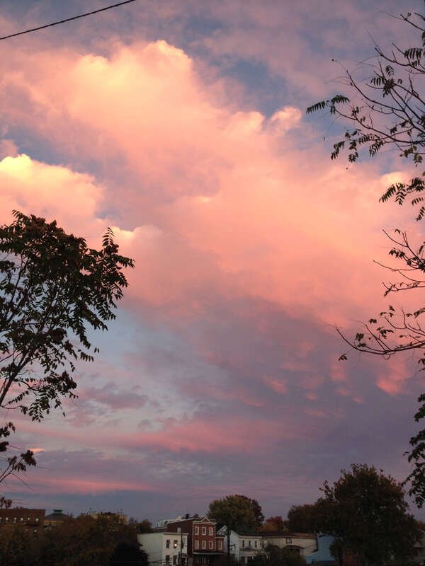 Cloud formations reflecting the sunset after a partly raining partly sunny day, taken while facing east in the parking lot of the American Self-Storage facility at 190 Baldwin Avenue in Jersey City, New Jersey.

This photo was created by Luigi Novi.